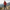 Homme randonneur portant une veste rouge, un pantalon outdoor, des chaussures de trekking et un sac à dos sur un sentier de montagne, idéal pour illustrer une tenue complète de randonnée avec Passion Randonnée.