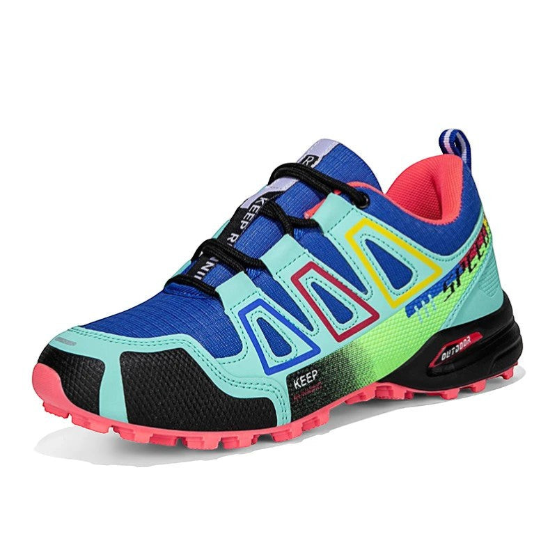 Chaussures de randonnée femme bleu et vert conçues pour la performance et l’adhérence.