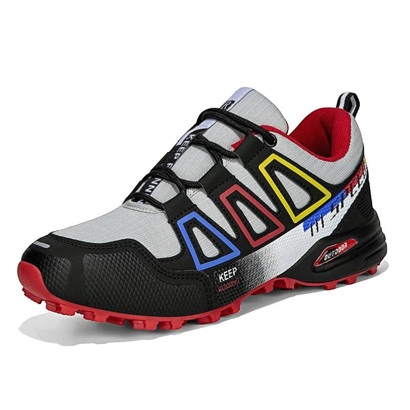 Chaussures de randonnée femme gris multicolore résistantes avec semelle antidérapante.