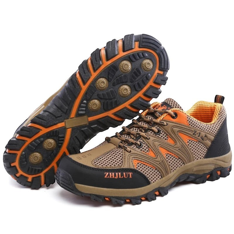 Chaussures de randonnée femme marron et orange idéales pour une utilisation outdoor sur tous types de terrain.