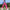 Pantalon femme rose Passion Randonnée porté en marche, avec poche zippée sur la jambe et coupe légère pour les sorties en plein air.