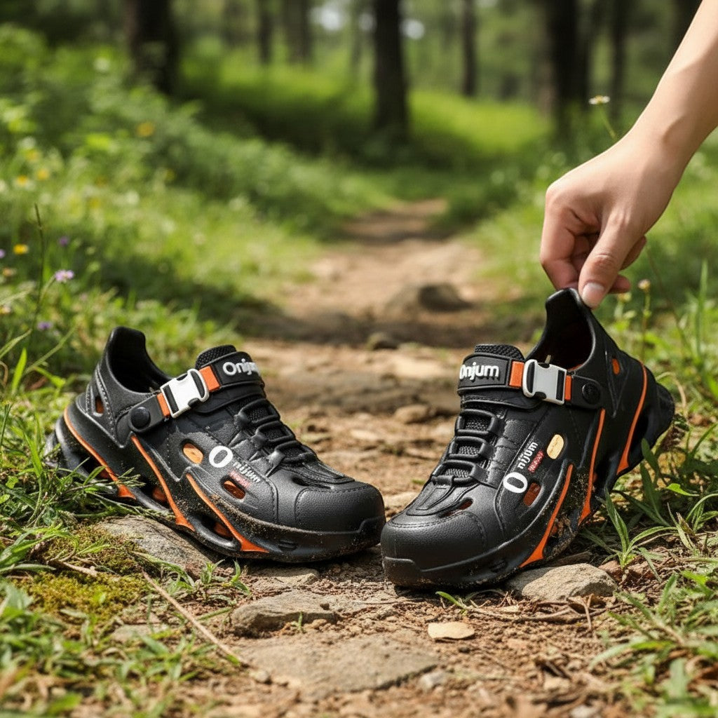 Sandales Passion Randonnée en EVA noir pour homme, avec des touches de couleur orange et une boucle blanche, respirantes et antidérapantes.