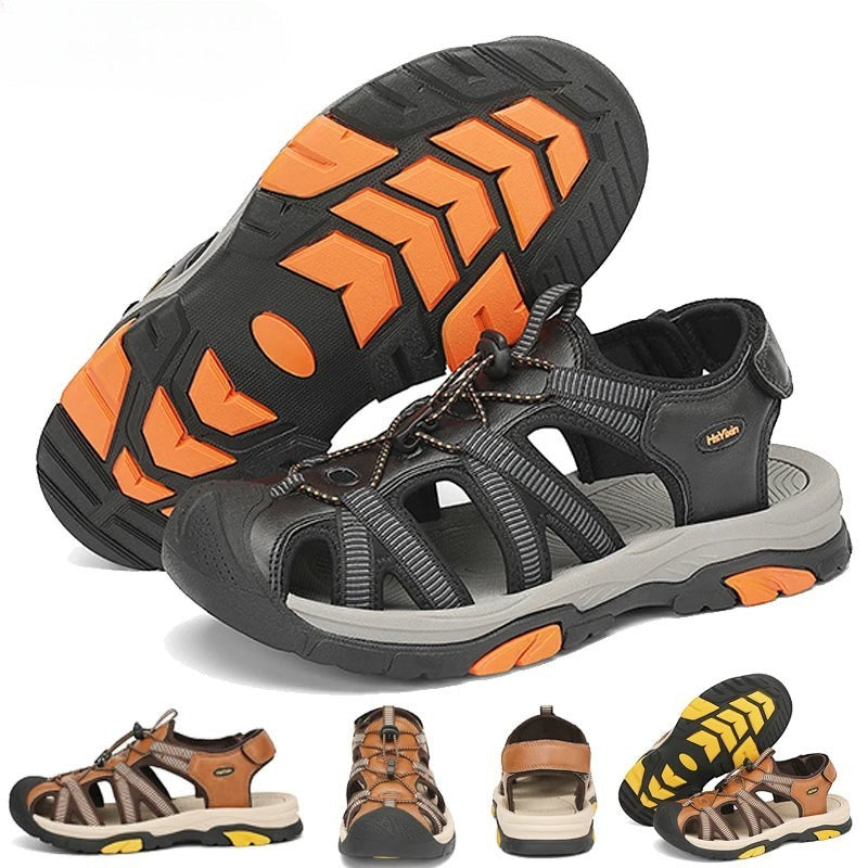 Sandales de randonnée unisexes Passion Randonnée en cuir noir, rehaussées de touches de gris et d'orange. Elles sont dotées de sangles réglables et d'une semelle en caoutchouc résistante.